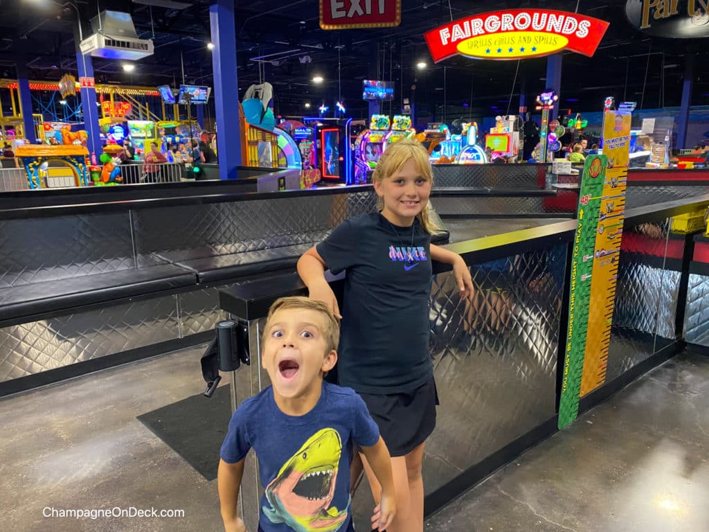 Incredible Pizza Co Things to do with kids in Kansas Kids at entrance of Pizza Company