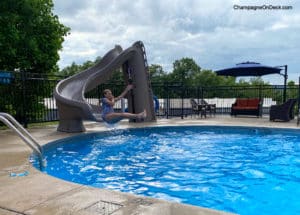 Kids sliding in pool in Branson KOA Kids sliding in pool in Branson KOA