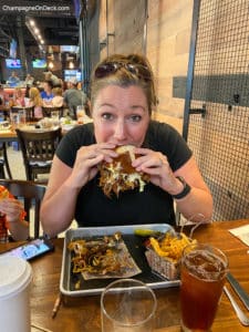 Things-to-do-in-Branson-Guy Woman eating sandwich in Branson