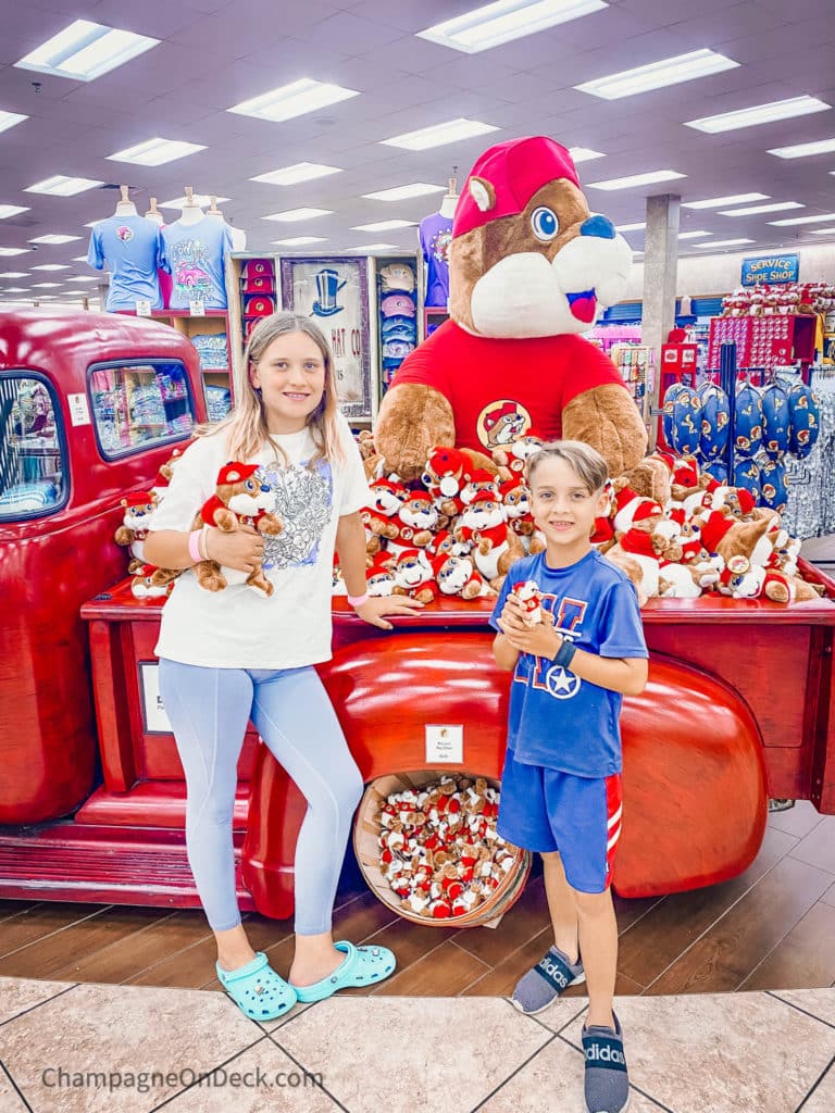 Family Road Trips from Dallas Bucees Family Road Trips from Dallas Kids standing in front of a Bucees store display