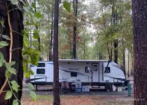 Camping Words RV in Woods Camping Words image of RV in the woods