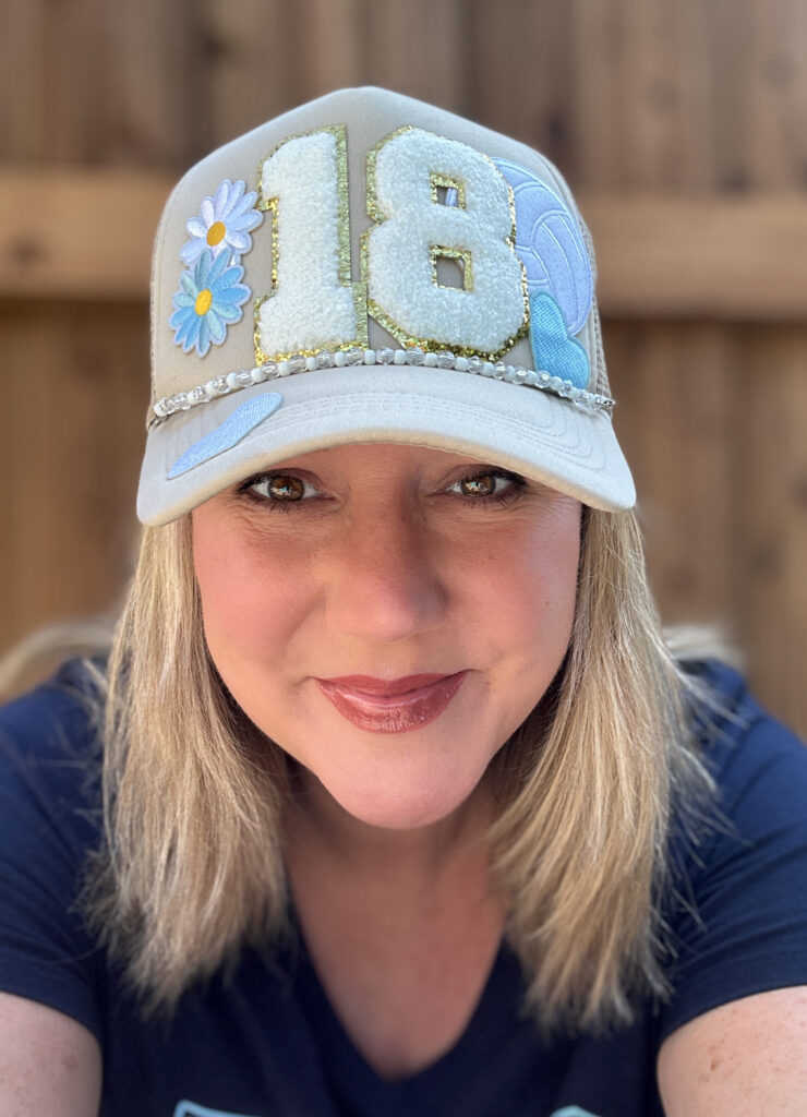 woman with a trucker hat on
